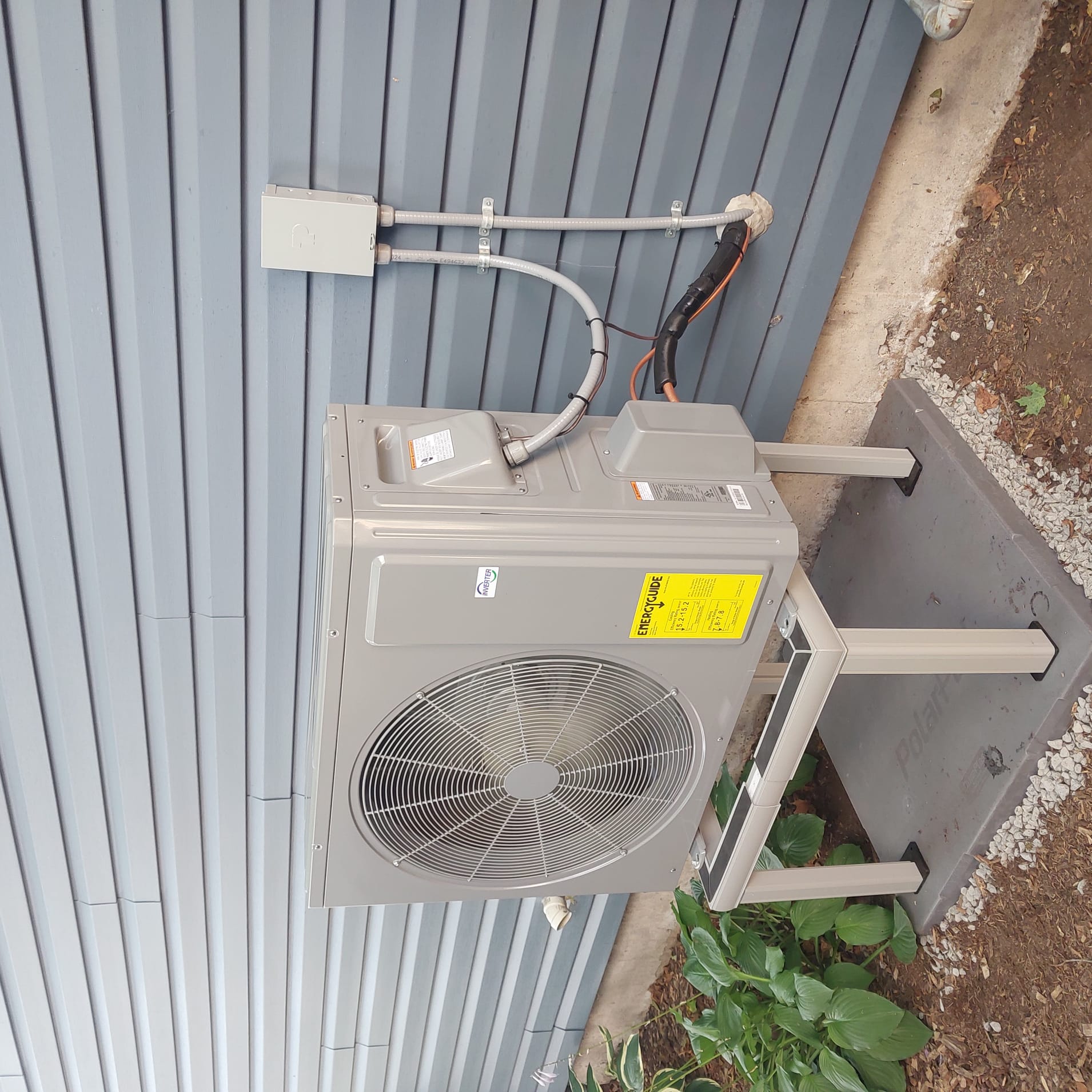 Cold climate heat pump installed outside a home in Ottawa.